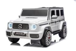 Elektrisches Kinderauto Mercedes-Benz G63 AMG 4x4, Zweisitzer, 24V, weiß, MP3-Player mit USB/AUX- und Bluetooth-Anschluss, Allradantrieb (4x4), Lithium-Batterie, EVA-Räder mit Federung, Kunstledersitze, Fernbedienung, lizenziert